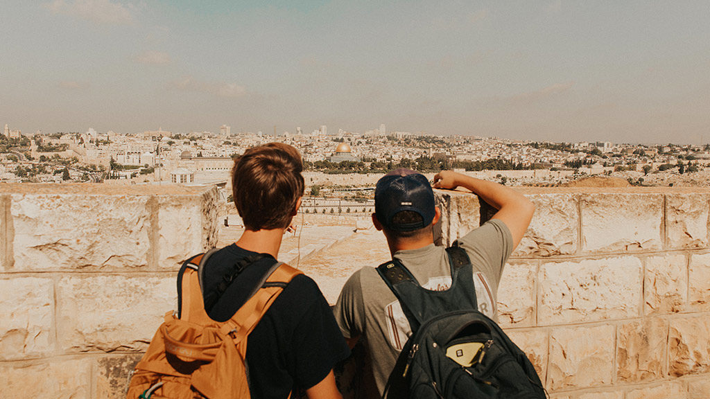 two tourists standing on the mount of olives