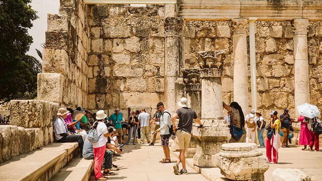 tourists in the ruins of capernaum
