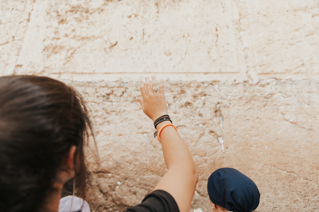 women saying blessings at the western wall