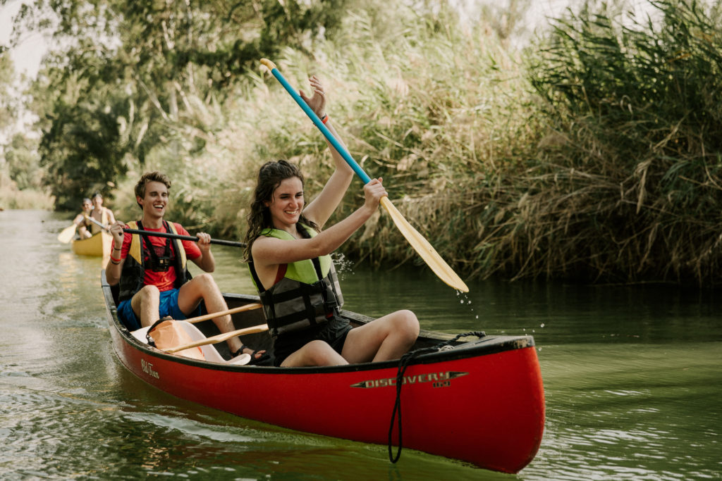 tourists kayaking down the jordan river