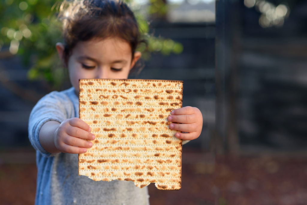 girl holding matzah