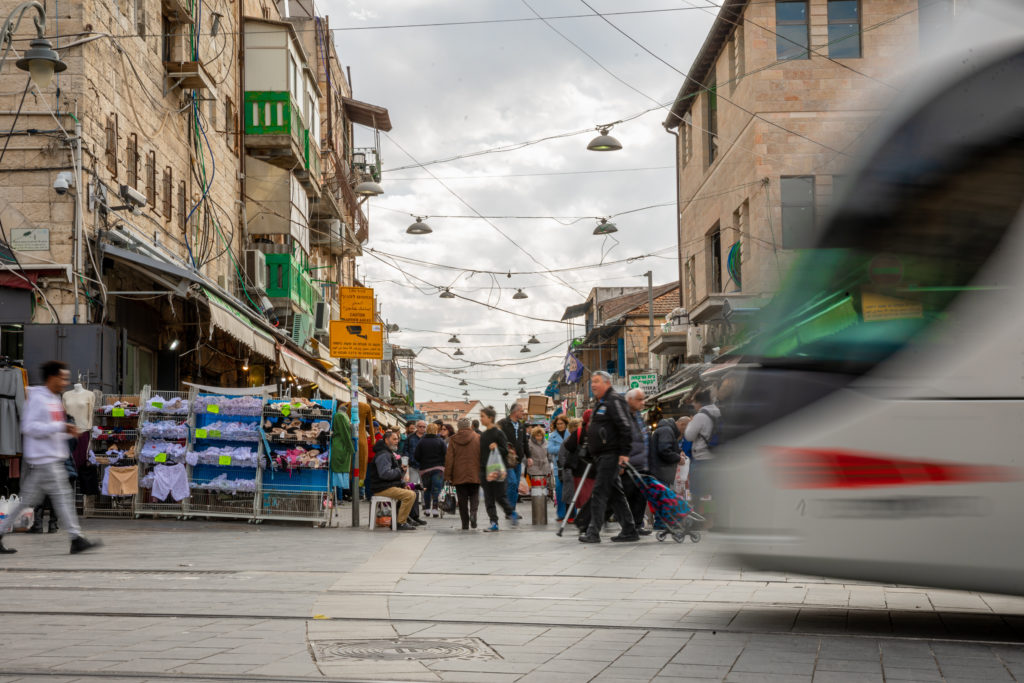 a busy market street in the middle of jerusalem